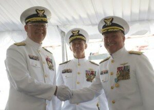  Rear Adm. Richard T. Gromlich (left) and Rear Adm. Keith A. Taylor (right) shake hands after Gromlich relieved Taylor of command of the 13th Coast Guard District during a formal ceremony presided over by Vice Adm. Paul F. Zukunft (center), commander of Coast Guard Pacific Area and Defense Forces West, held at Coast Guard Base Seattle, June 28, 2013. Taylor was recognized during the ceremony for his efforts in strengthening partnerships with local, state, federal and international organizations during his two years in command. U.S. Coast Guard photo by Petty Officer 3rd Class Katelyn Tyson.
