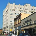 Commercial Street in downtown Astoria, Oregon, with the former Hotel Astoria in the background